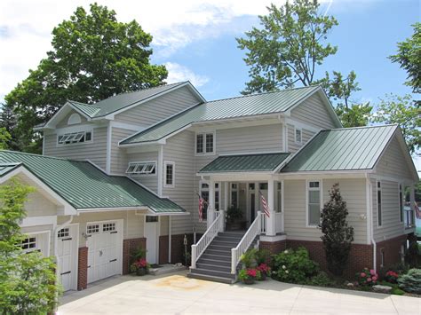 house colors with green metal roofs|matching paint to green roof.